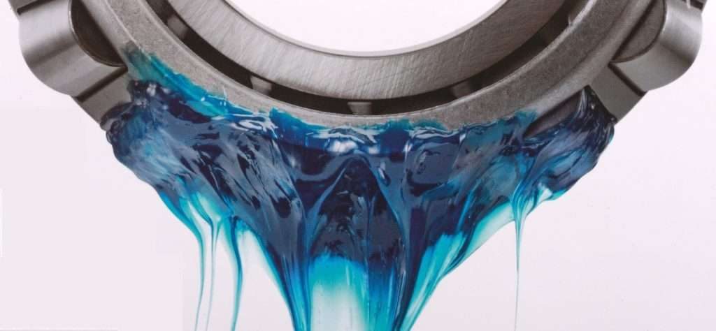 A blue color Lubricating grease dripping from a bearing