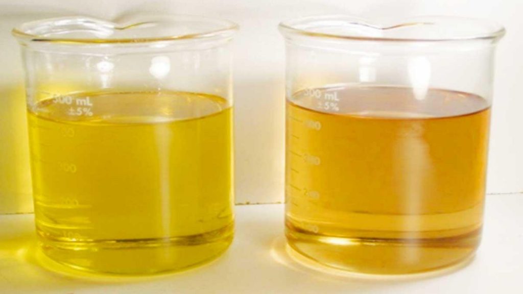 Two samples of oil lubricants showing the difference in it's purity