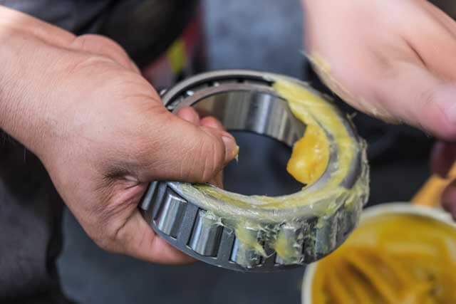 applying grease on bearings